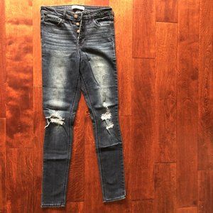 High-rise destroyed button fly skinny jeans